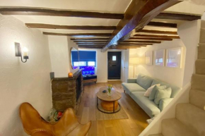 1750's cottage with open fire and beams